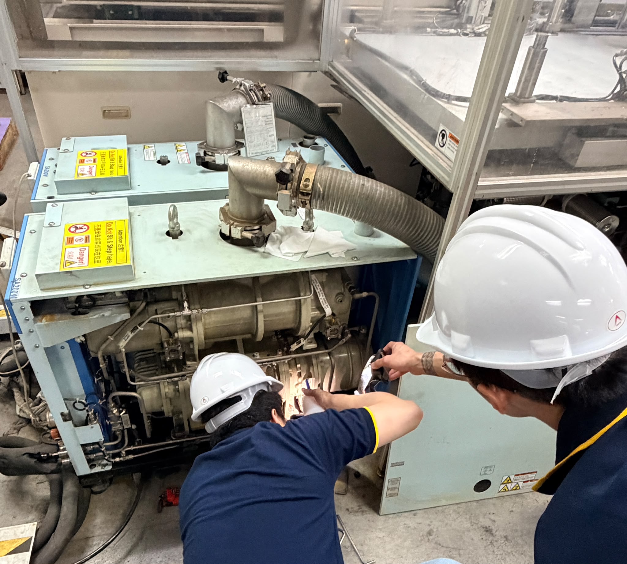 HSR engineering team reviewing industrial plans
